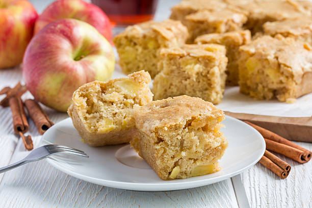 Homemade blondie (blonde) brownies apple cake, square slices on plate Homemade blondie (blonde) brownies apple cake, square slices on plate, horizontal blondy stock pictures, royalty-free photos & images