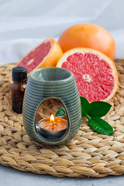 istock Aroma lamp with grapefruit essential oil, spa background, vertical 601129196