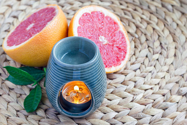 istock Aroma lamp with grapefruit essential oil, spa background, horizontal 601129290