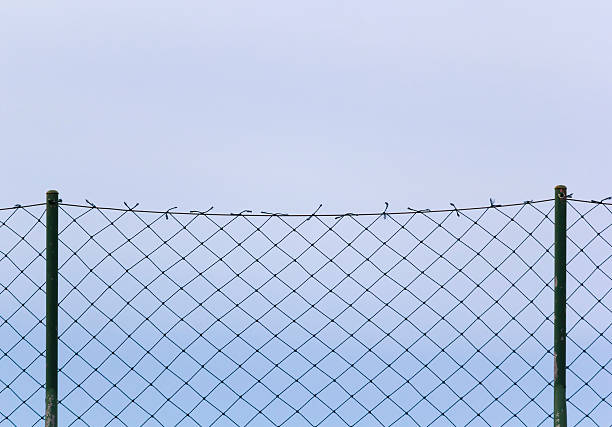 istock steel mesh sky blue backgroun 601133784