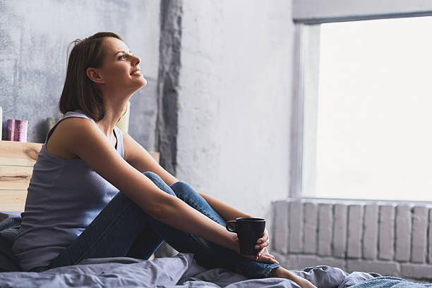 istock woman smiling and looking up 601134068