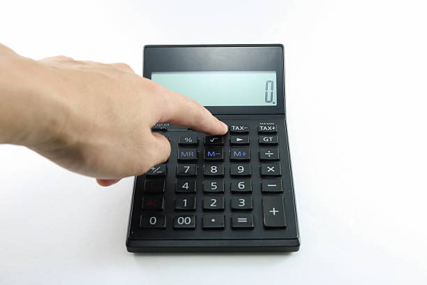 istock Man hand push button black calculator on white background isolated. 601136120