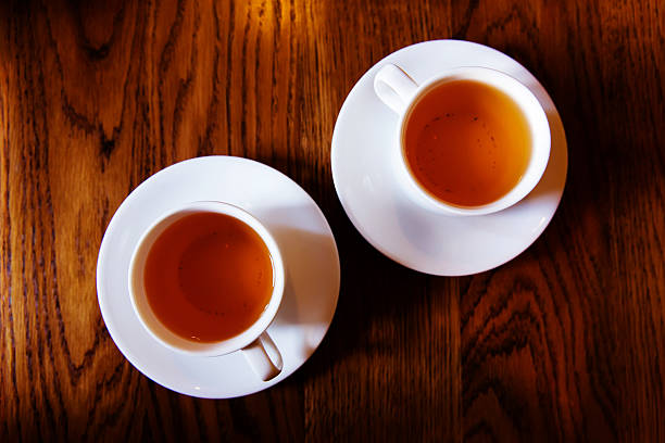 istock Cups of tea on a wooden background 601138248