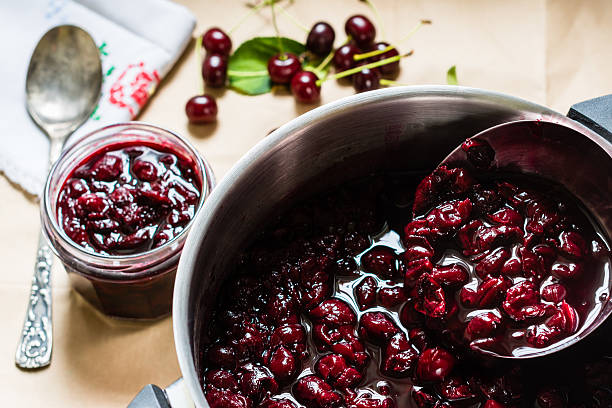 Cooked homemade cherry jam in the bowl stock photo