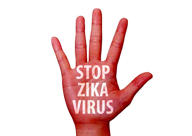 istock stop zika virus written on woman hand 601142242