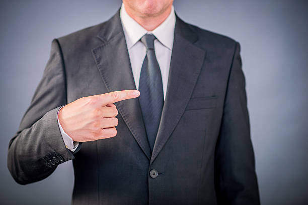 istock Businessman Pointing towards a solution  over gray background 601142362
