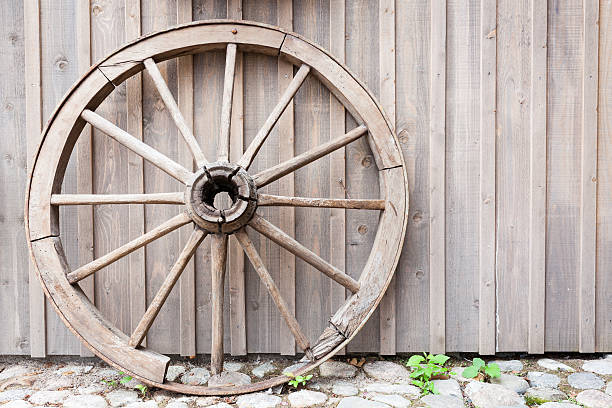 istock Old cartwheel leaning against wall 601144456