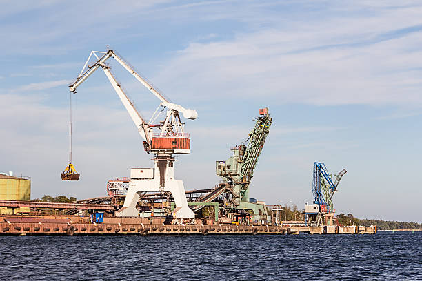istock Working crane unload cargo in a seaport in Sweden 601145616