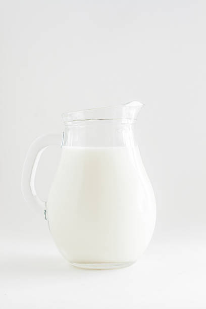 istock full transparent jug of milk on a white background 601146090