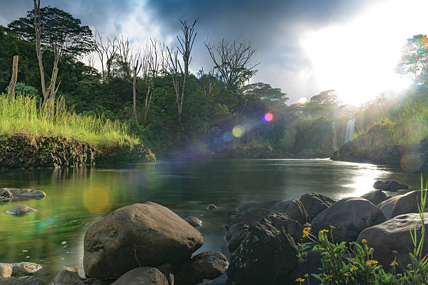 Pe'epe'e falls on the Wailuku river with dramatic light