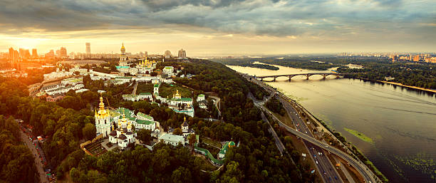Aerial view of Kiev-Pechersk Lavra monastery, Ukraine Panoramic view of Kiev Pechersk Lavra at sunset. Aerial view. General view of the city and the Dnipro river and beautiful sunset sky. kyiv stock pictures, royalty-free photos & images