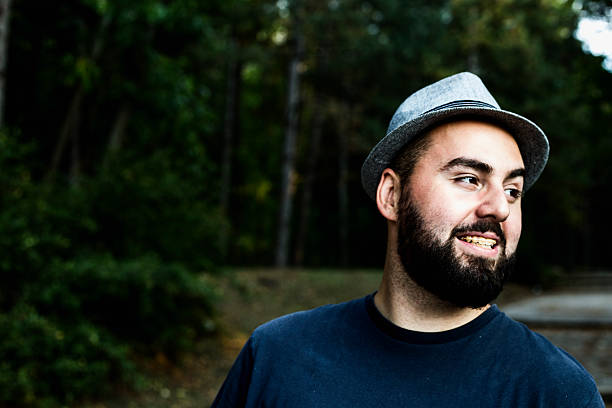 istock Happy laughing young man in park 601147552