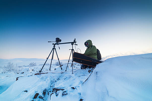 istock Man with photo camera on tripod taking timelapse photos in 601149500