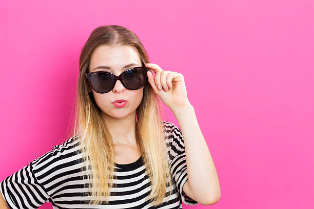 istock Young woman with sunglasses 601151750