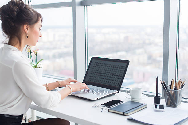 istock Young businesswoman working in office, typing, using computer. Concentrated woman 601151786