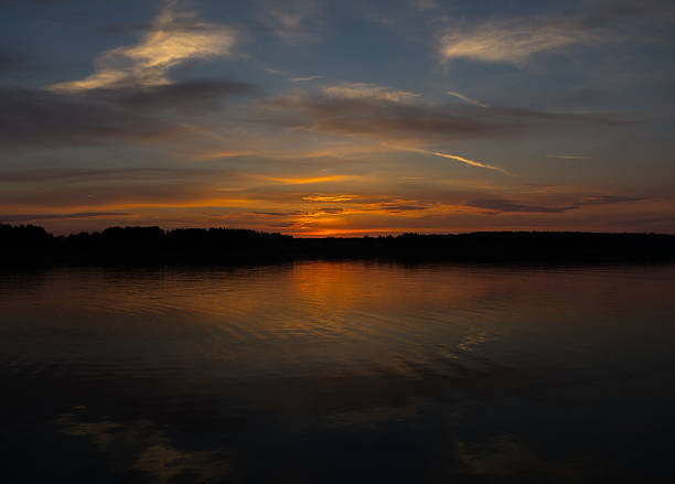 istock Majestic red sunset and its reflection in river 601151856