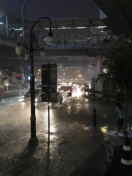 istock tropical rain in bangkok at night 601152272
