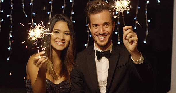istock Young couple celebrating new year with sparklers 601153066