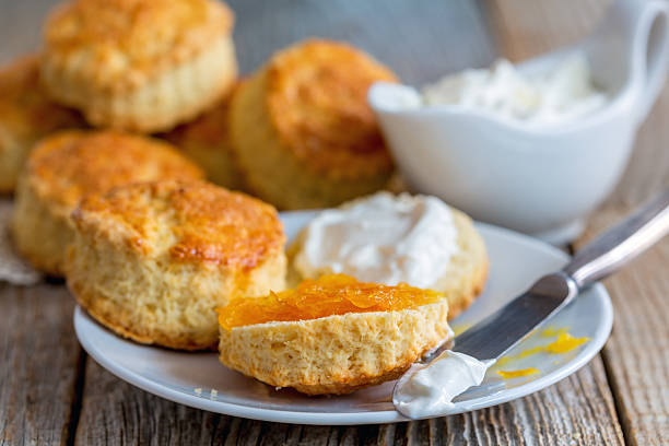 istock Scones with orange jam and whipped cream. 601153746