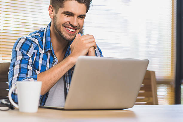 istock happy successful freelancer just doing his job and receiving mon 601154684