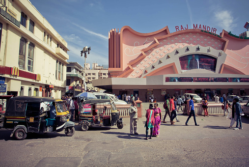 Jaipur, India - February 22, 2015: People going to a famous movie theater Raj Mandir, opened in 1976 in Pink City on February 22, 2015. Jaipur, with population 6,664000 people, is a capital of Rajasthan