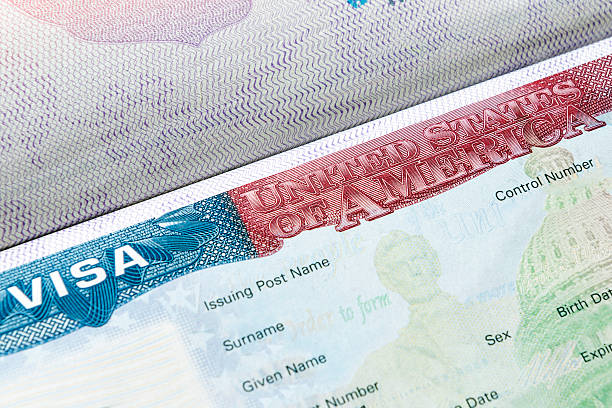 USA visa in passport Close up of United Kingdom visa in passport passport stamp stock pictures, royalty-free photos & images