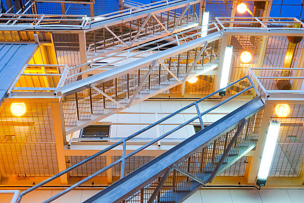 istock fire escape ladder upper view on offshore platform with lighting. 601156378