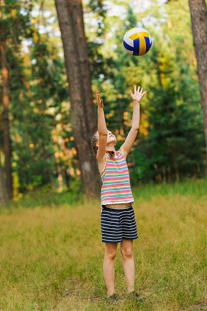 istock girl throwing a ball 601156838