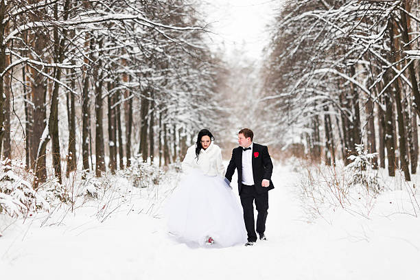 istock Happy bride and groom in winter wedding day 601157372