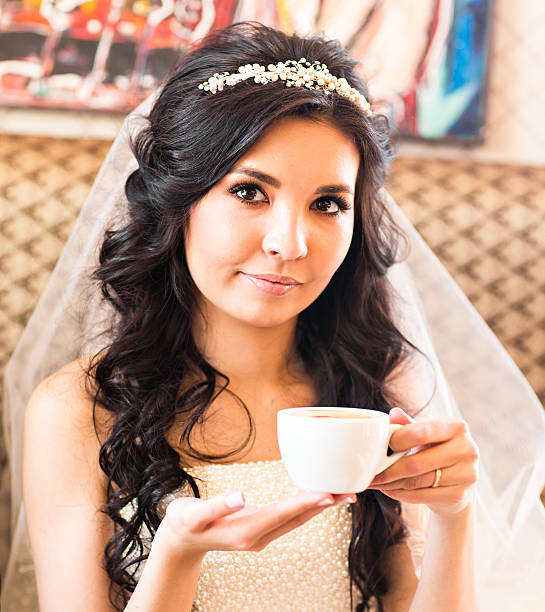 istock bride with a cup of coffee 601158668