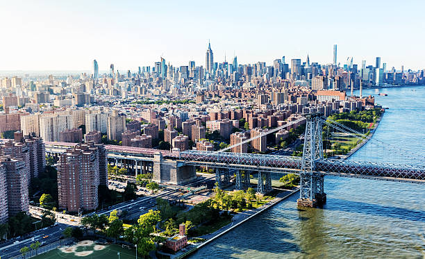 Williamsburg Bridge over the East River in Manhattan, NY Aerial view of the the Williamsburg Bridge over the East River in Manhattan, New York City williamsburg bridge stock pictures, royalty-free photos & images