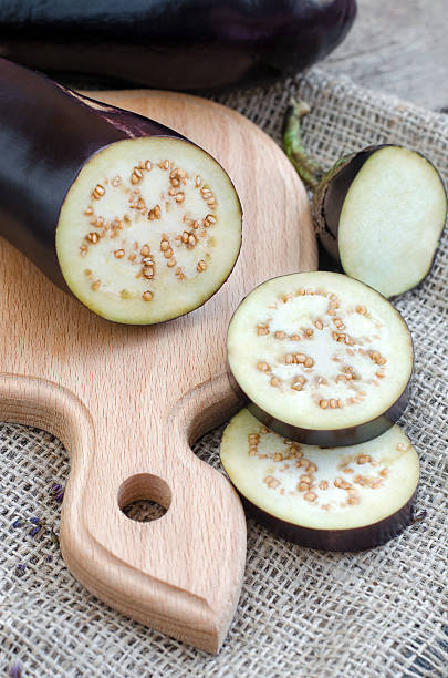 istock Sliced eggplants on a wooden table 601358394