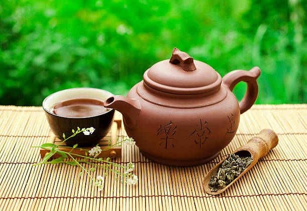 istock Chinese clay teapot with a cup of puer tea 601359732