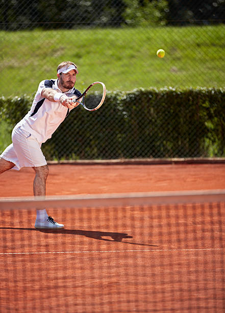 istock Sportsman playing tennis game 601360118