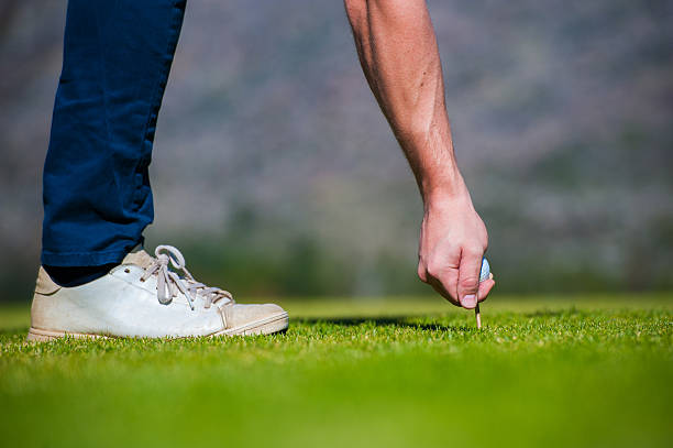 istock view of a golfer teeing off from a golf tee 601360306