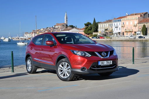 Rovinj, Croatia, January, 25th, 2014: Nissan Qashqai stopped on the street. The second-generation of the Qashqai, the most important car for Nissan in Europe, was revealed in 2013. The Qashqai is available in versions: 1.2 DIG-T (115 HP) petrol engine, 1.5 dCi (110 HP) diesel engine and 1.6 dCi (130 HP) diesel engine. The all-wheel-drive system is available only in the strongest version.