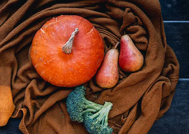 Photo of Autumn seasonal vegetables - Pumpkin, pears and broccoli.