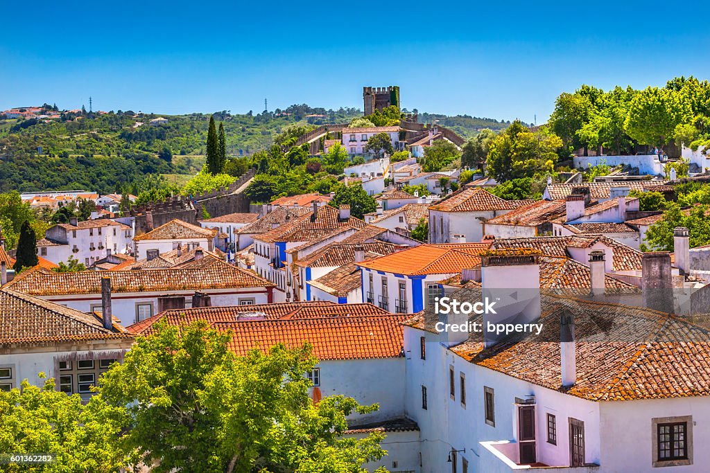 Castle Turrets Towers Walls Orange Roofs Obidos Portugal Castle Wals Turrets Towers Medieval Town Obidos Portugal. Castle and walls built in 11th century after town taken from the Moors. Obidos Stock Photo