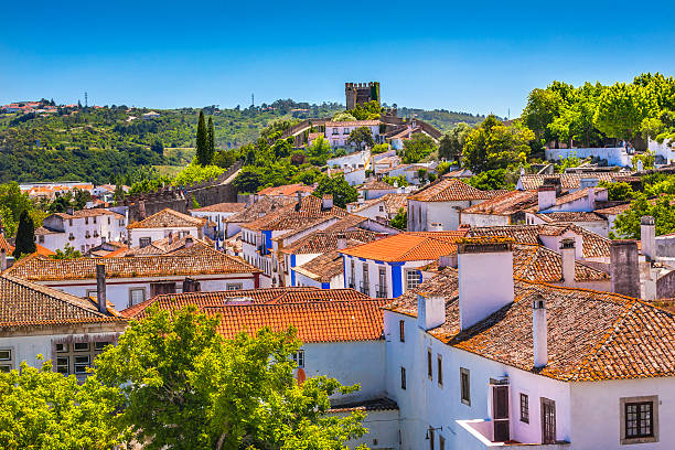 Castle Turrets Towers Walls Orange Roofs Obidos Portugal Castle Wals Turrets Towers Medieval Town Obidos Portugal. Castle and walls built in 11th century after town taken from the Moors. obidos photos stock pictures, royalty-free photos & images