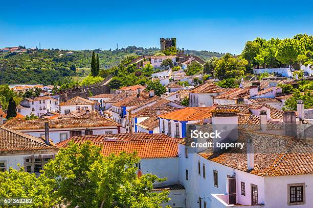 Castle Turrets Towers Walls Orange Roofs Obidos Portugal Stock Photo - Download Image Now