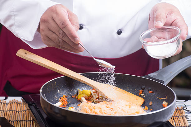 istock Chef putting sugar for cooking Pad Thai 601362752