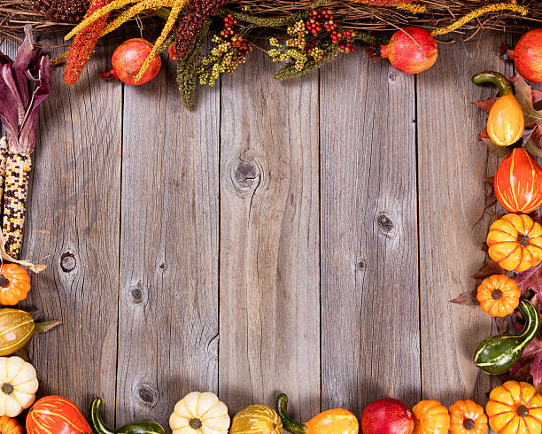 istock Complete border of autumn gourd decorations on rustic wooden boa 601362856