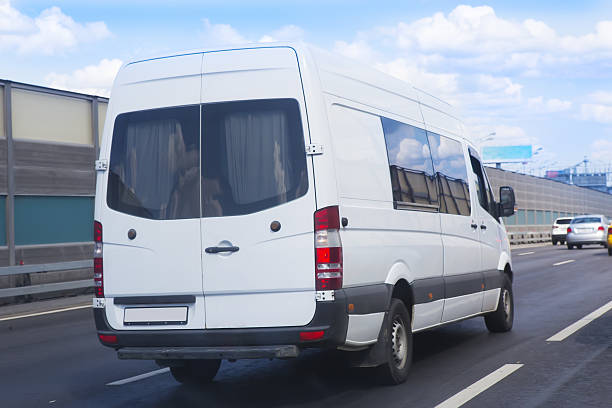 istock minibus goes on the city street 601363740