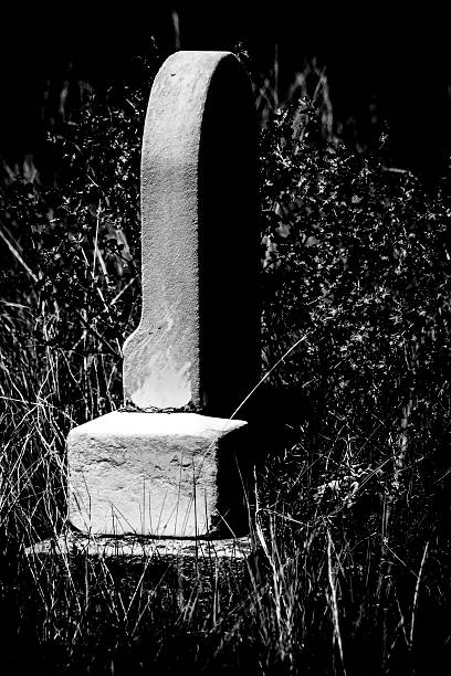 istock Spooky Gravestone in a Moonlite Cemetary 601366198