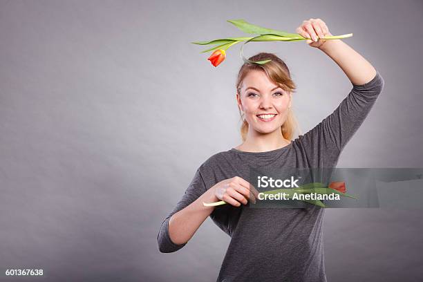 Playful Girl Having Fun With Flowers Tulips Stock Photo - Download Image Now - Achievement, Black Color, Celebration