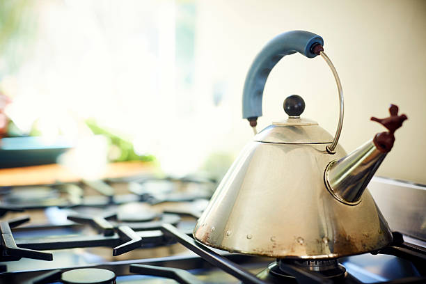 istock Close-up of tea kettle on stove in kitchen 601370112