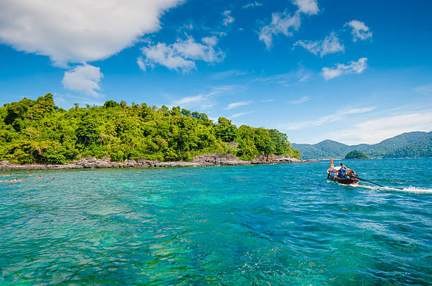 istock Beautiful tropical sand beach against the blue sky. 601371578