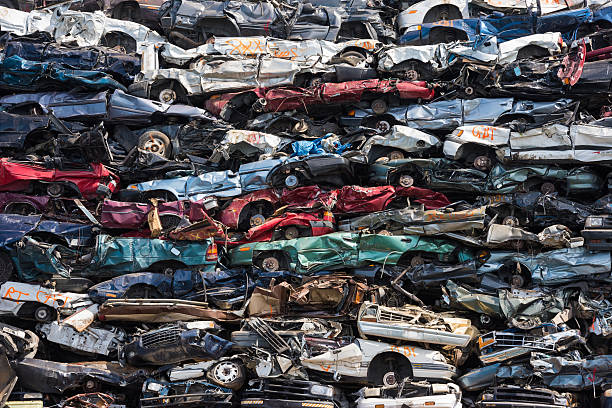 Heap of scrap cars Crushed cars stacked up for recycling junkyard photos stock pictures, royalty-free photos & images