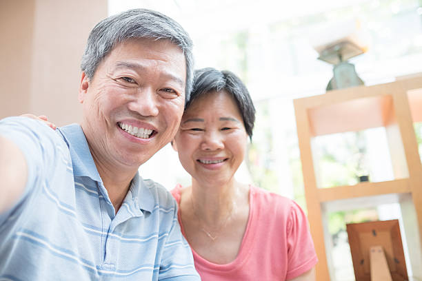 istock Old couple selfie happily 601374200