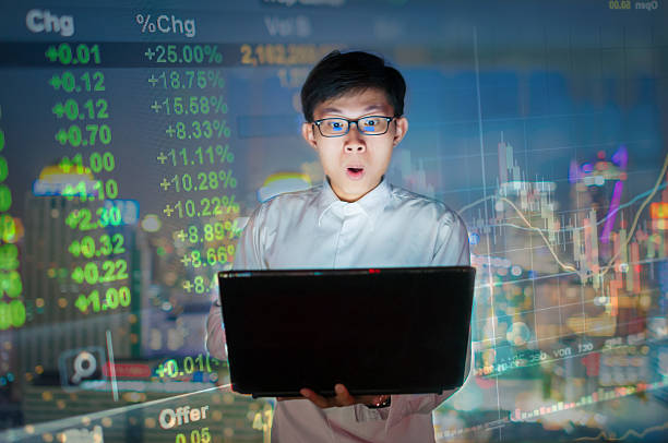 istock Businessman using a laptop on the rooftop of a skyscraper 601374830